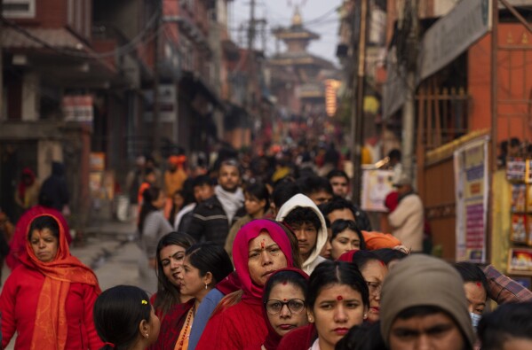 Tens of thousands gather for Hindu festival at Nepal temple, with many lighting up marijuana joints